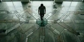 Overhead view of an individual standing on a complex mosaic floor depicting diverging career paths, with subtle green glows hinting at new education resources.